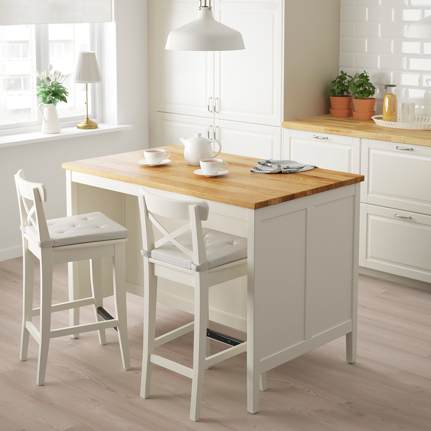 https://www.ikea.com/us/en/images/products/tornviken-kitchen-island-off-white-oak__0870928_pe684550_s5.jpg?utm_source=chatgpt.com